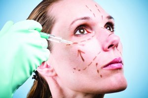 Woman getting cosmetic surgery procedure